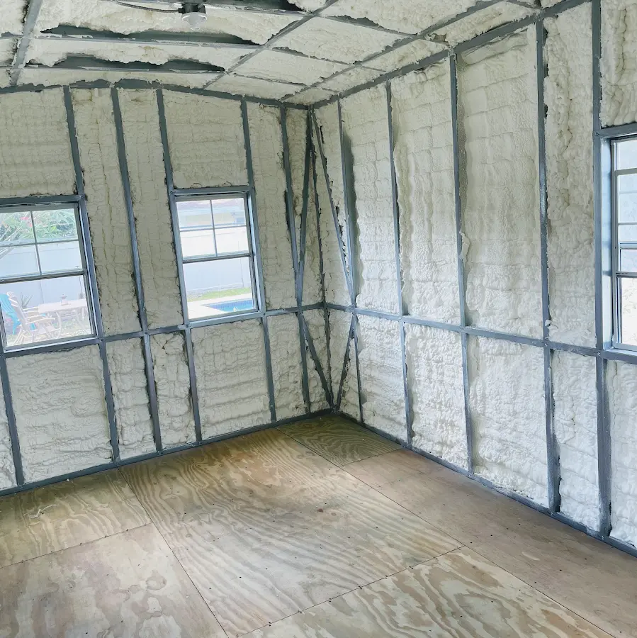 Closed-cell spray foam insulation applied to wall cavities in a residential project in Blair